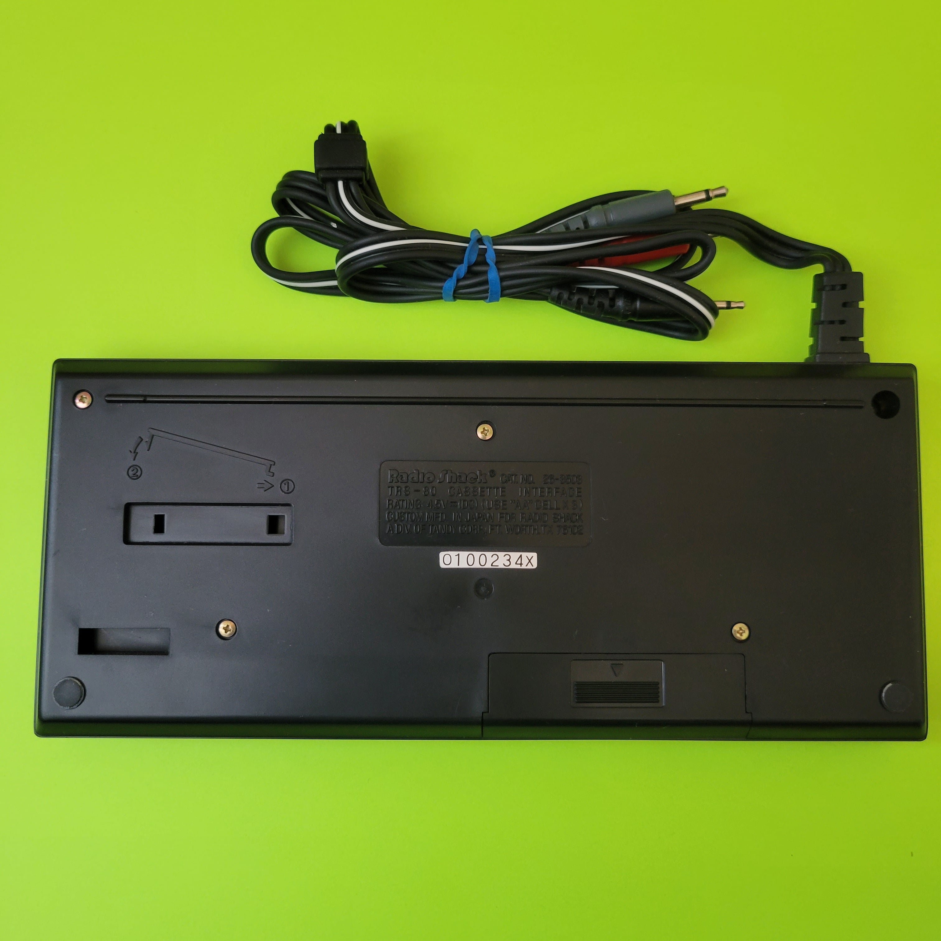 An image of the back of a Radio Shack TRS-80 PC-1 cassette interface